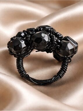 Black beaded ring with a unique design